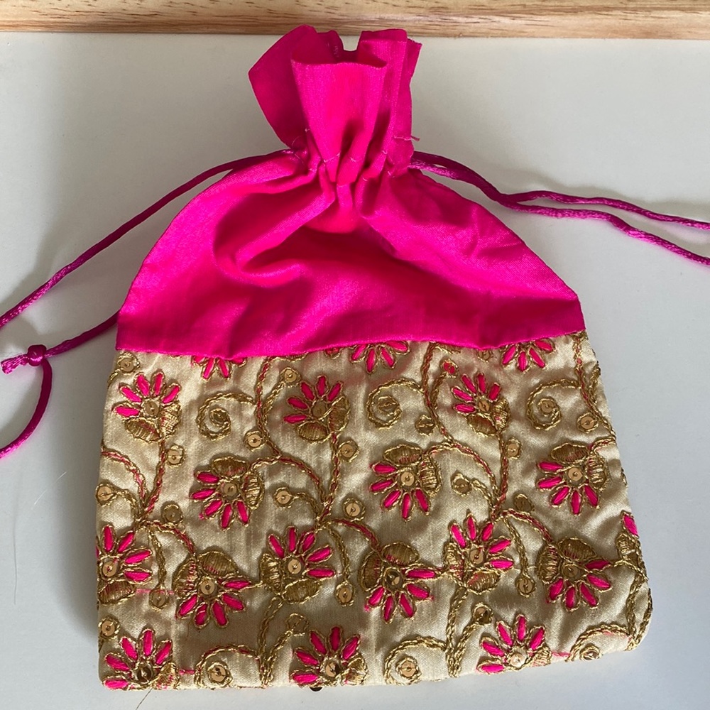 Beautiful hot pink & gold embroidered purse.